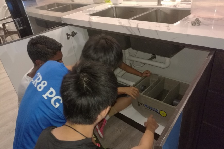 Field trip for students to study kitchen’s grease trap process